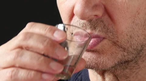 4K Old Man Taking A Drink Of Medical Drops Stock Footage 61357392
