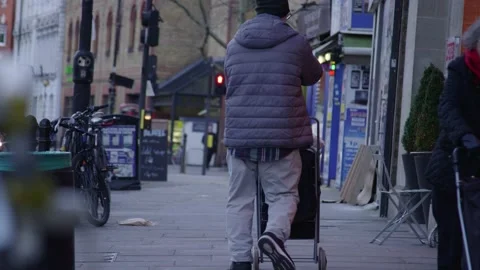 4K OLD MAN WALKING THE STREETS OF LONDON Stock Footage 136528413