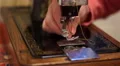 4K Old married lady hands threading a needle on a vintage sewing machine 4k or 4k+ Resolution