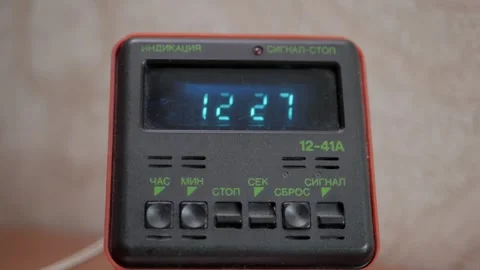 4K old soviet alarm clock with a clock stands on the table Stock Footage 261975352