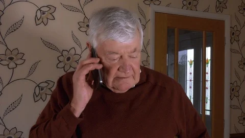 4K - Older Man Talking on Mobile Moving around Home - Handheld Video stock 87162318
