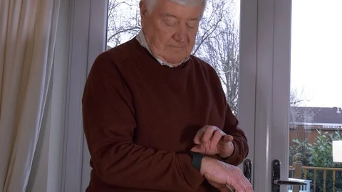 4K - Older Man using Smart Watch at Home Video stock 87162347