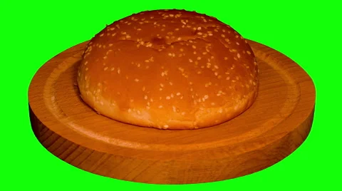 4k – One big hamburger bun on wooden board  Stock Footage 57654403