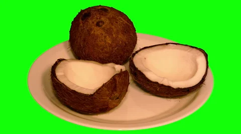 4k – One coconut and two halves on plate Stock Footage 56842257