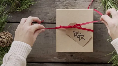 4K Open Gift Box with Merry Christmas Text and Pine Tree Graphic Stock Footage 332157869