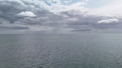 4K Open Sea View with Small Boat and Cloudy Sky Stock-Footage 333411692