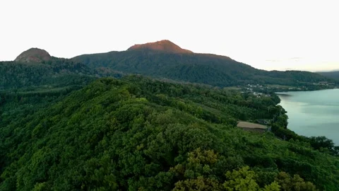 4k Orbit aerial footage of an active volcano mount Usu during sunrise Stock Footage 289387547