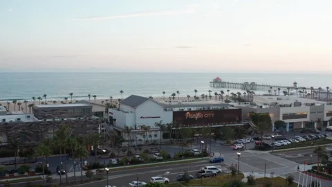 4K orbiting aerial drone view of Pacific City in Huntington Beach, California Stock Footage 112855853