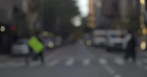 4K - Out of focus city block with pedestrian and car crossing, New York City Stock Footage 165139680