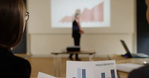 4K Over shoulder view of cheerful business man &amp; woman chatting in a meeting Stock Footage 101353522