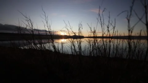 4k over the stenness loch with a view over to the hoy hills in Orkney Video stock 297768211