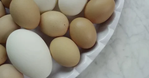4k Overhead dolly move over selection of eggs Stock Footage 81338018