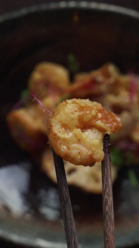 4K overhead video chopstick pulling up wasabi shrimp out of plate - vertical Stock Footage 315123288