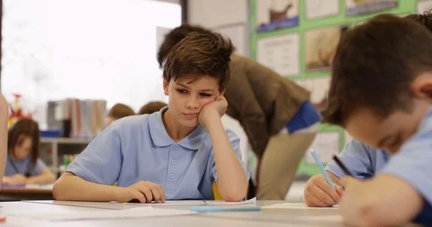 4k, Overworked and bored young student sitting in classroom. Slow motion. Stock Footage 74269258