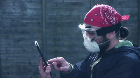 4K Painter or Builder Man Working on his Tablet Stock Footage 68715931