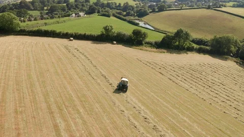 4K Pan Around Tractor Sorting Silage Bales in Rural Devon Video stock 112327283