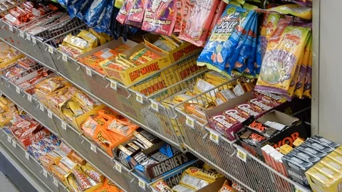 4K Pan Of Candy Bars In Store Stock Footage 89565597