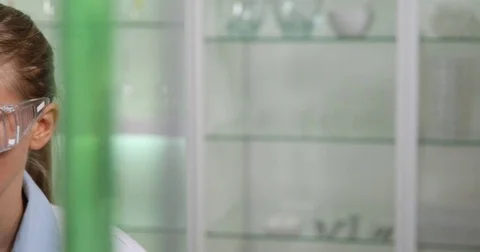 4K Pan left closeup analyst woman portrait studying genetic microscopic tests Stock Footage 78777045