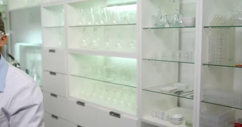 4K Pan left smiling scientist worker woman looking camera presentation science Stock Footage 78772202