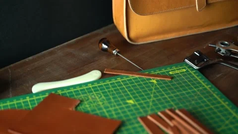 4k pan movement camera of small business leather bag workshop Stock Footage 146260283