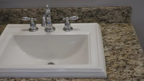 4K Pan Over White and Silver Bathroom Sink 库存影片 123087046
