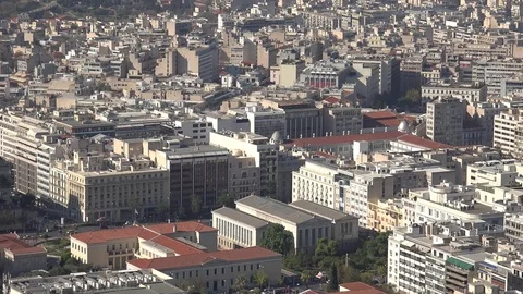 4K Pan right Athens crowded cityscape by day panoramic view residential houses Stock Footage 78710997