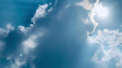 4K Pan Right Bright Blue Sky with White Clouds and Sun Rays Jakarta Indonesia Stock Footage 344746300