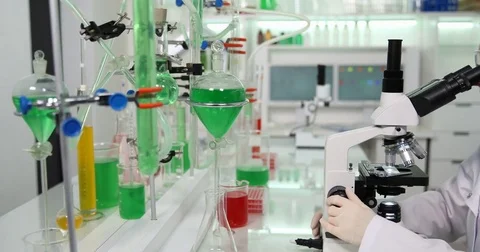 4K Pan right busy expert person in chemistry lab biologist profession microscope Stock Footage 78773106