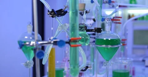 4K Pan right closeup biologist woman work exchanging liquid material micro-plate Stock Footage 78773357