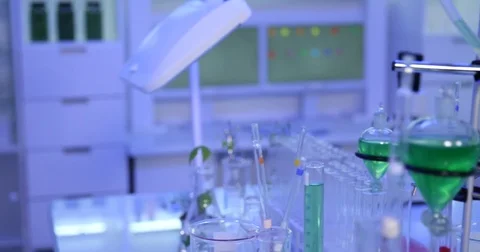 4K Pan right closeup biologist woman multiply virus pipetting using microwell Stock Footage 78778345