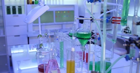 4K Pan right closeup scientist worker woman researching chemical tube industry Video stock 78804653