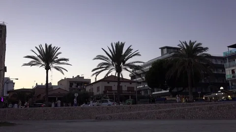 4K Pan right famous Palma Majorca Spanish resort at twilight modern hotel emblem Stock Footage