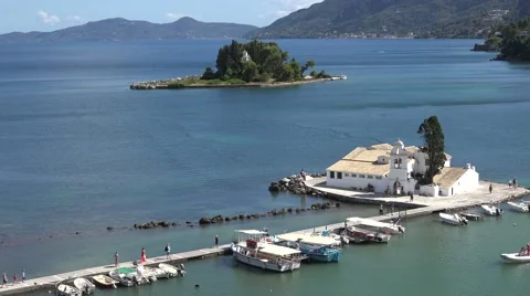 4K Pan right panoramic view of Pontikonisi Island and Vlacherna Monastery Corfu  Stock-Footage 65796476