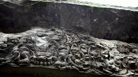 4k, Pan View of low relief at Ta Promt temple in Cambodia with spider.-Dan Stock Footage 119056233