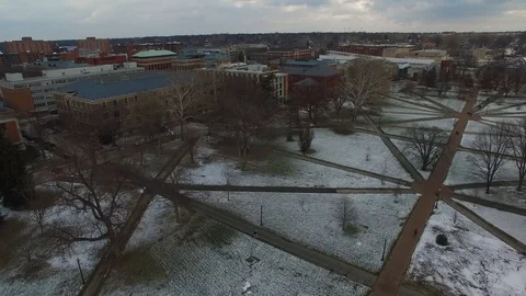 4K PANNING DRONE SHOT OVER THE SNOWY GRASS OF OHIO STATE'S NORTH OVAL Video stock 101813661