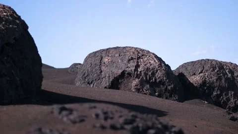 4k Panning medium shot of volcanic soil and igneous rocks. Lanzarote, Timanfaya Stock Footage 154553575