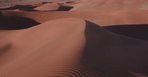 4K panning shot of the endless sand dunes of the Namib desert Stock-Footage 64696914