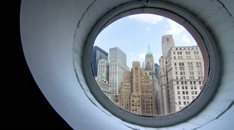 4k panning timelapse of lower Manhattan cityscape through a round window Stock Footage 44116832