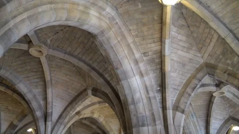 4K Panning View of inside University of Glasgow Cloisters with Fairy Lights Stock Footage 261764089