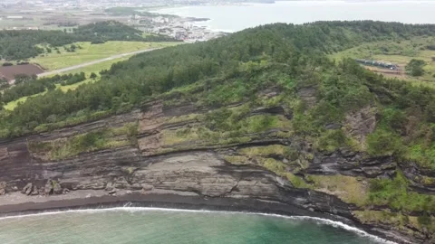 4K Panning View of West Cliff of Songaksan (송악산) Mountain, Jeju Volcanic Island Stock Footage 143864448