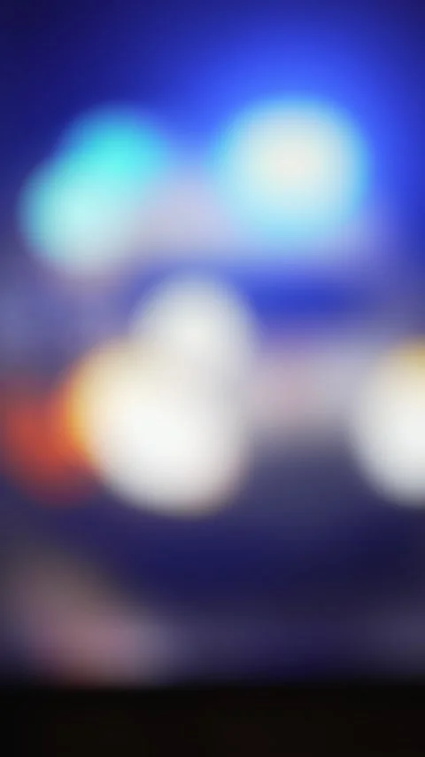 4k, Panoramic blurred view of ambulance parked on pavement with blue warning Stock Footage 333702077