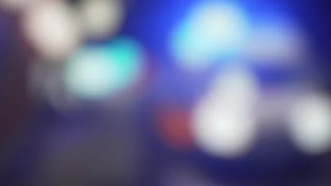 4k, Panoramic blurred view of ambulance parked on pavement with blue warning Stock Footage 333702126