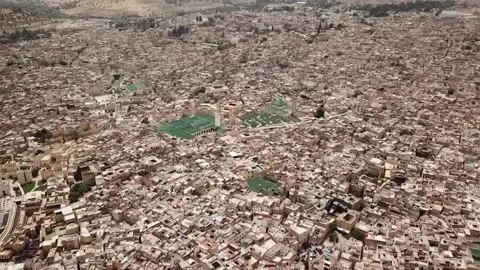 4K Panoramic Drone Shot of the Infinite Urban Fabric of Fez Medina and Historic Stock Footage 330976230