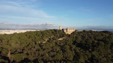 4k panoramic video ascending towards Bellver Gotic Castle Mallorca within nature Stock Footage 166575384