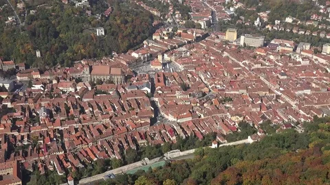 4K Panoramic view crowded Brasov old town red rooftop building by day landmark Stock Footage 80072837