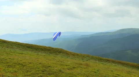 4k, Paraglider flying high in the mountains Video stock 53301191