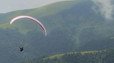 4k, Paraglider flying high in the mountains Video stock 53301358