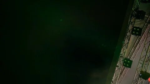 4K part of performing stage construction visible with vapour and green flashes 動画素材 118941584