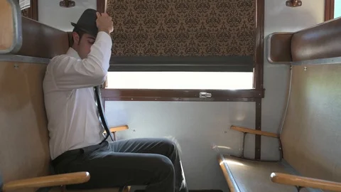 4K passenger making himself comfortable in train car checking his map Stock Footage 90806399