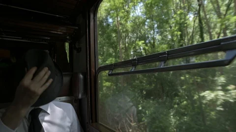 4K passenger making himself comfortable in train car Stock Footage 90809156